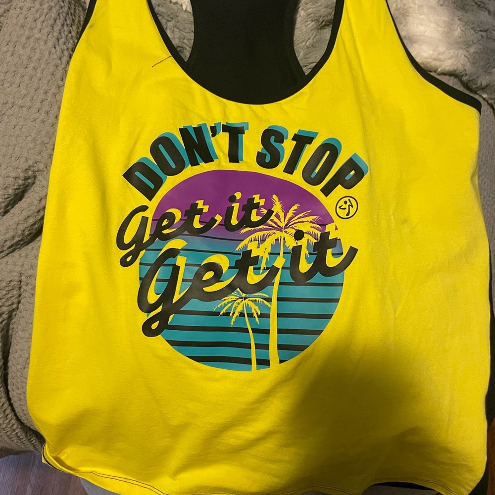 XXLovely Zumba tank it is too big for me now. Worn only a couple of times.